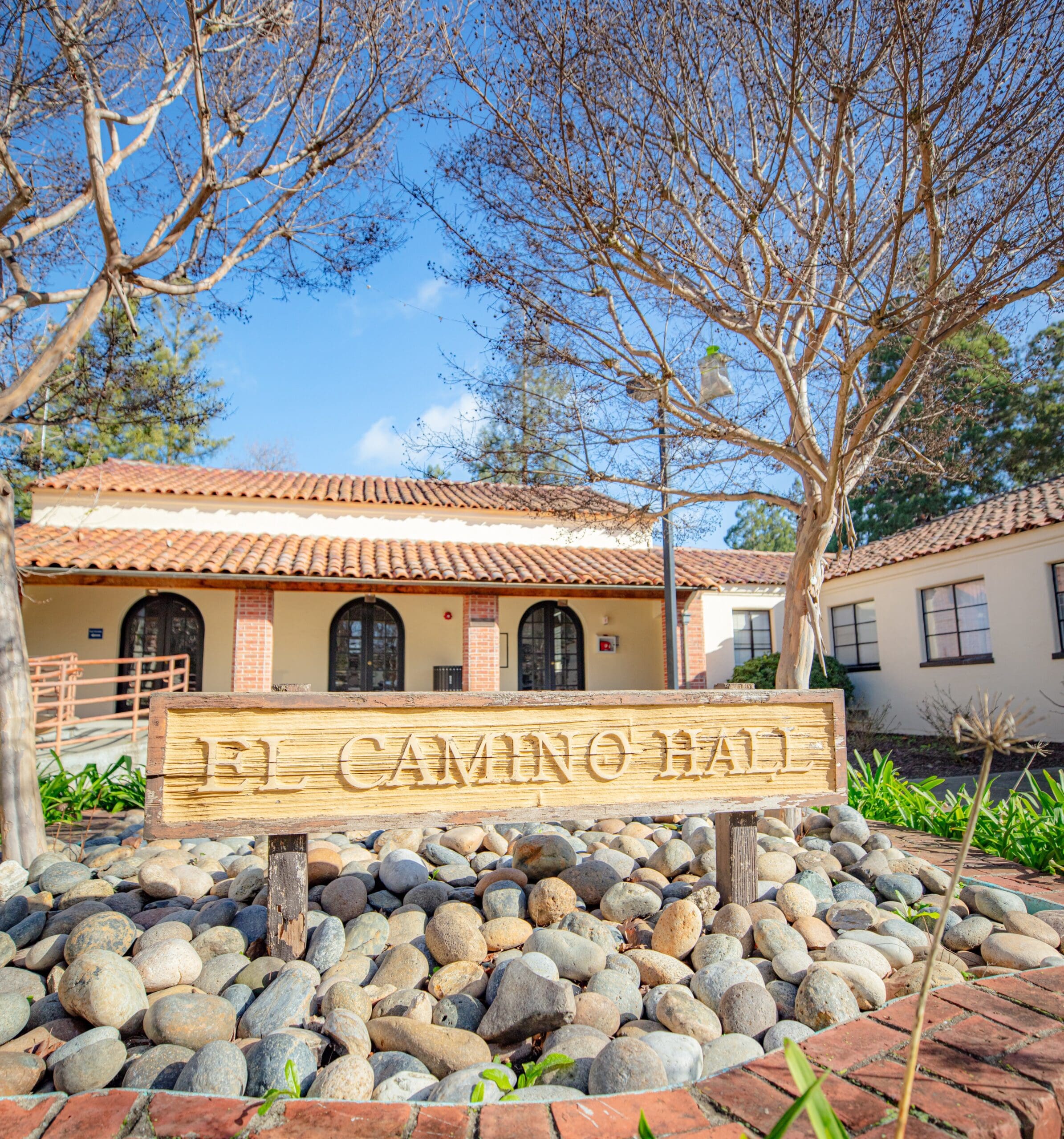 Picture of the El Camino Hall sign out front of an exterior shot of the building