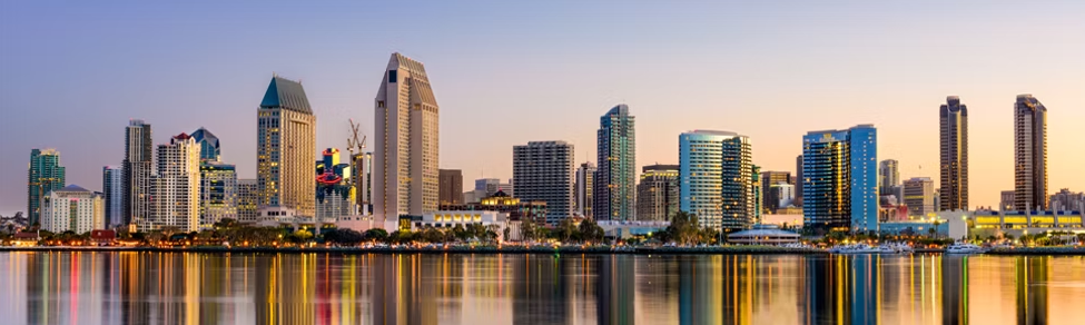 San Diego downtown skyline reflected on the waterfront at sunset.