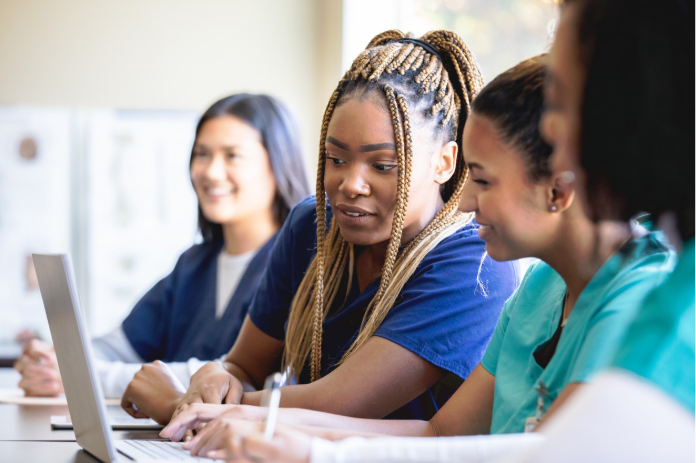 Nursing students sitting in a medical class at college