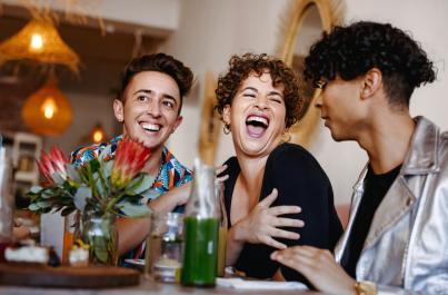 Friends laughing at restaurant