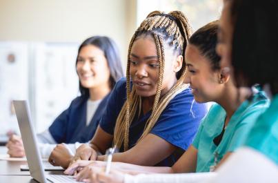 Nursing students sitting in a medical class at college