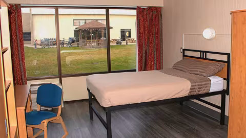 Lambton College Residence - Bedroom features double bed, desk & chair