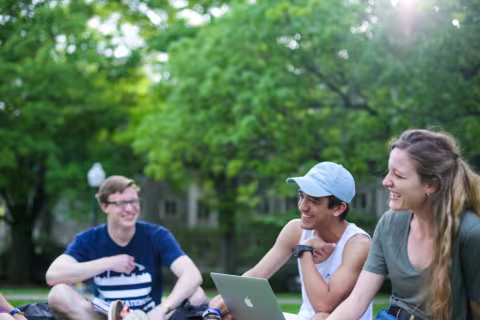 Students enjoy the beauty of campus in the summer