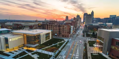 An ariel view of Cleveland State University looking down Gallery street with a sunset in the background
