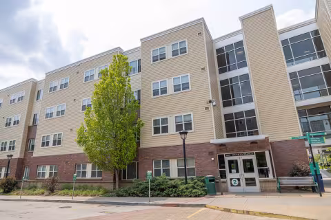 A street view exterior picture of Euclid Commons residence hall featuring the South Entrance