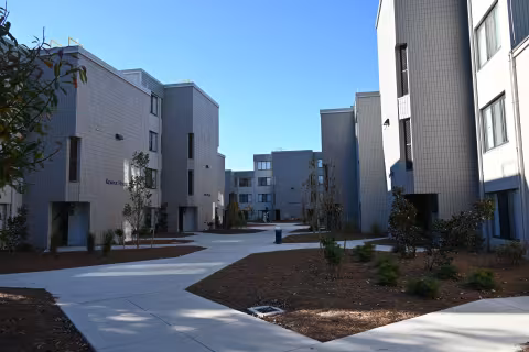 An exterior picture of the walking paths between the multiple residence halls 