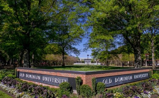 The ODU brick sign surrounded by greenery and landscape as a welcome into space 