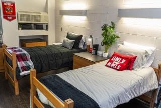 2 Beds side by side in a dorm room